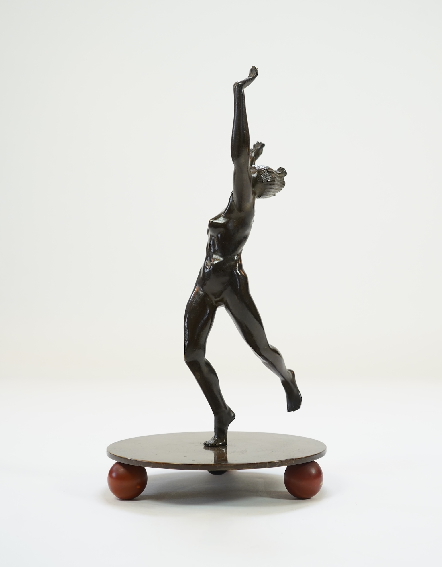 An Art Deco Austrian patinated bronze of a nude female dancer in the manner of Otto Hafenrichter